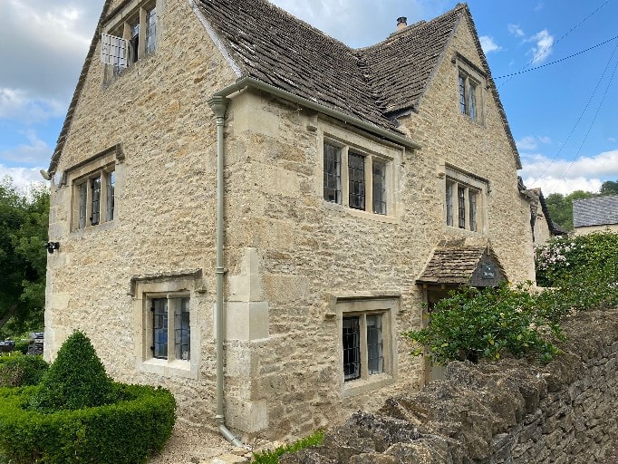 House in Cranham restored from cement rendering to traditional lime
