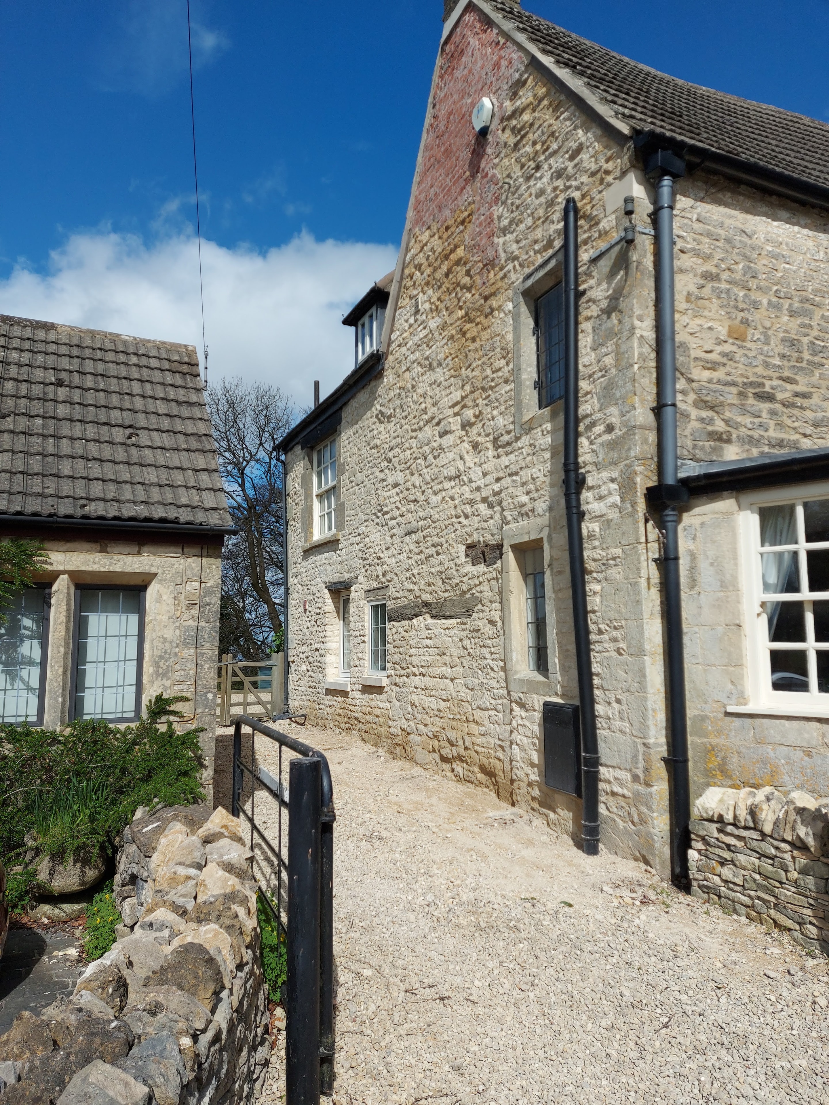 Gable at Birdlip restored from cement render to lime